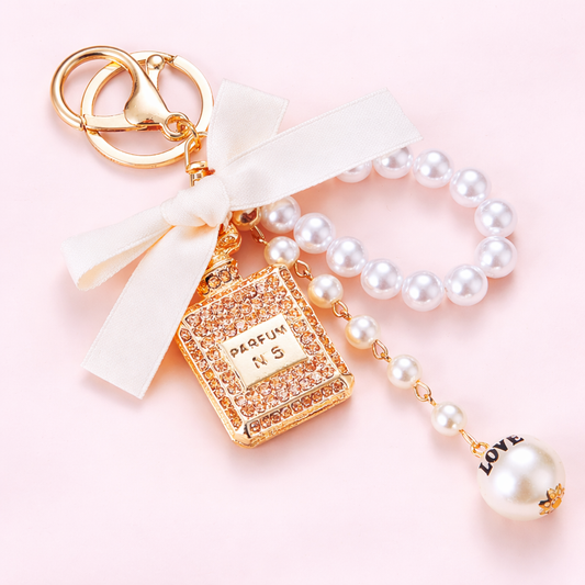 Beige Bow Knot Perfume Bottle Metal Keychain.