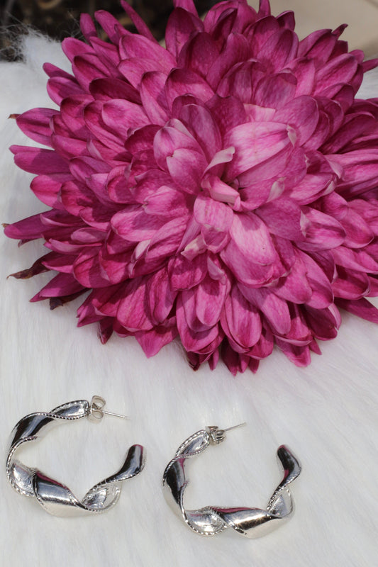 Ribbon Twist Stainless Steel Hoop Earrings.