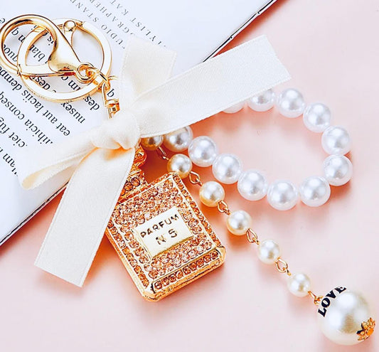 Beige Bow Knot Perfume Bottle Metal Keychain.